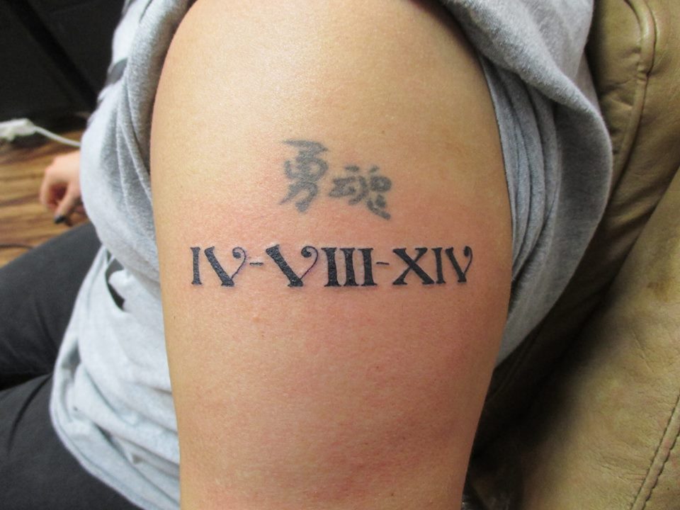 4. Roman Numeral Bicep Tattoo Placement - wide 5