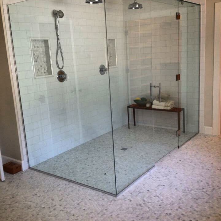 Curbless shower pan with white Carrara hexagon