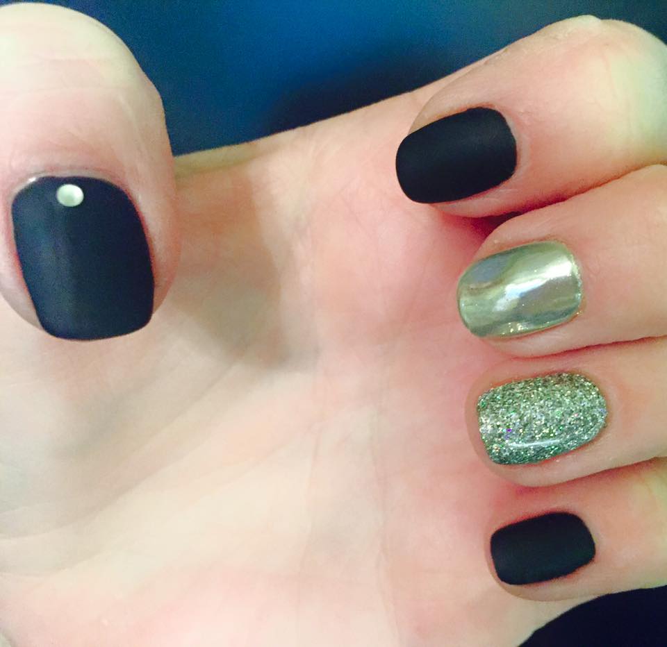 Mat black, metallic, glitter and gems nail art design