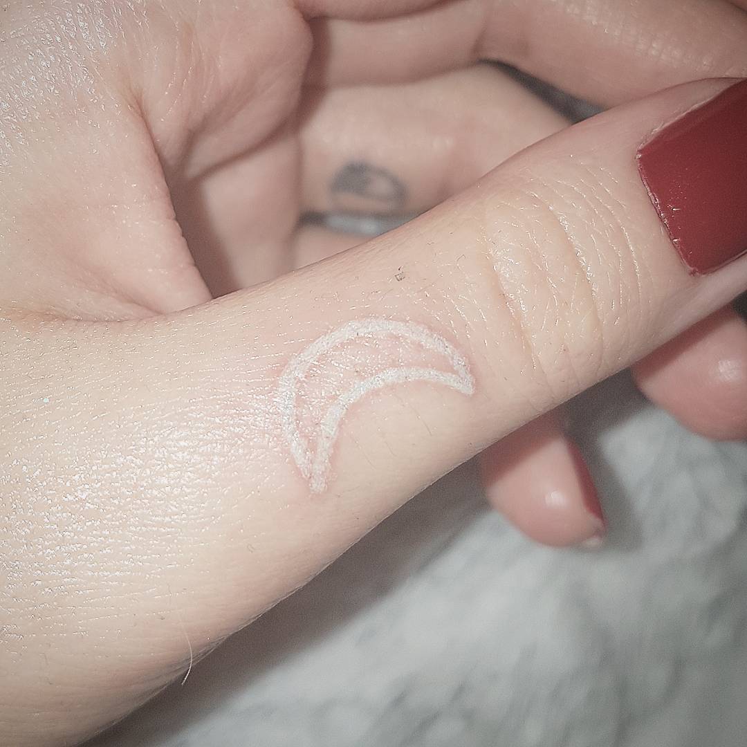 White Moon Tattoo On Thumb