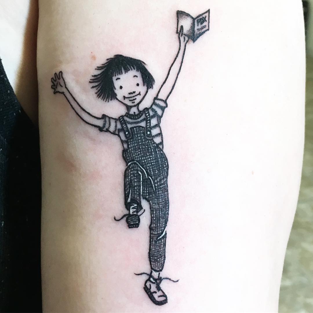 A kid With Book Inked on Arm