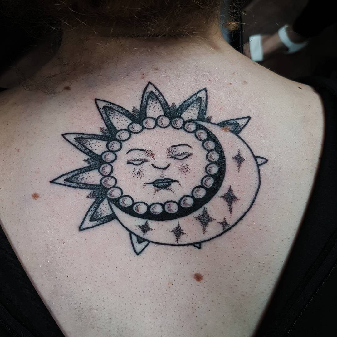 Black And Grey Sun And Moon Tattoo On Back