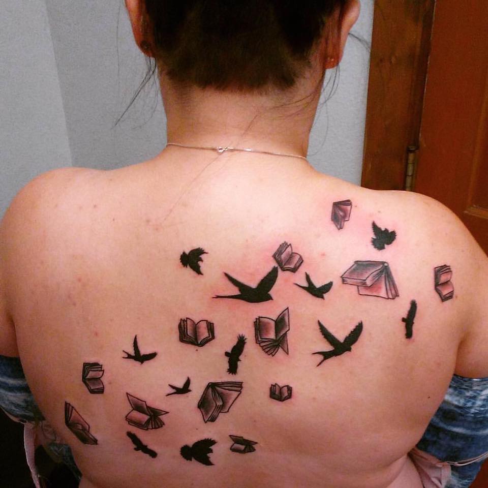 Book With Birds Inked On Back