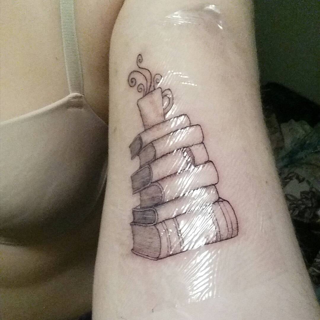 Books With Coffee Inked On Arm