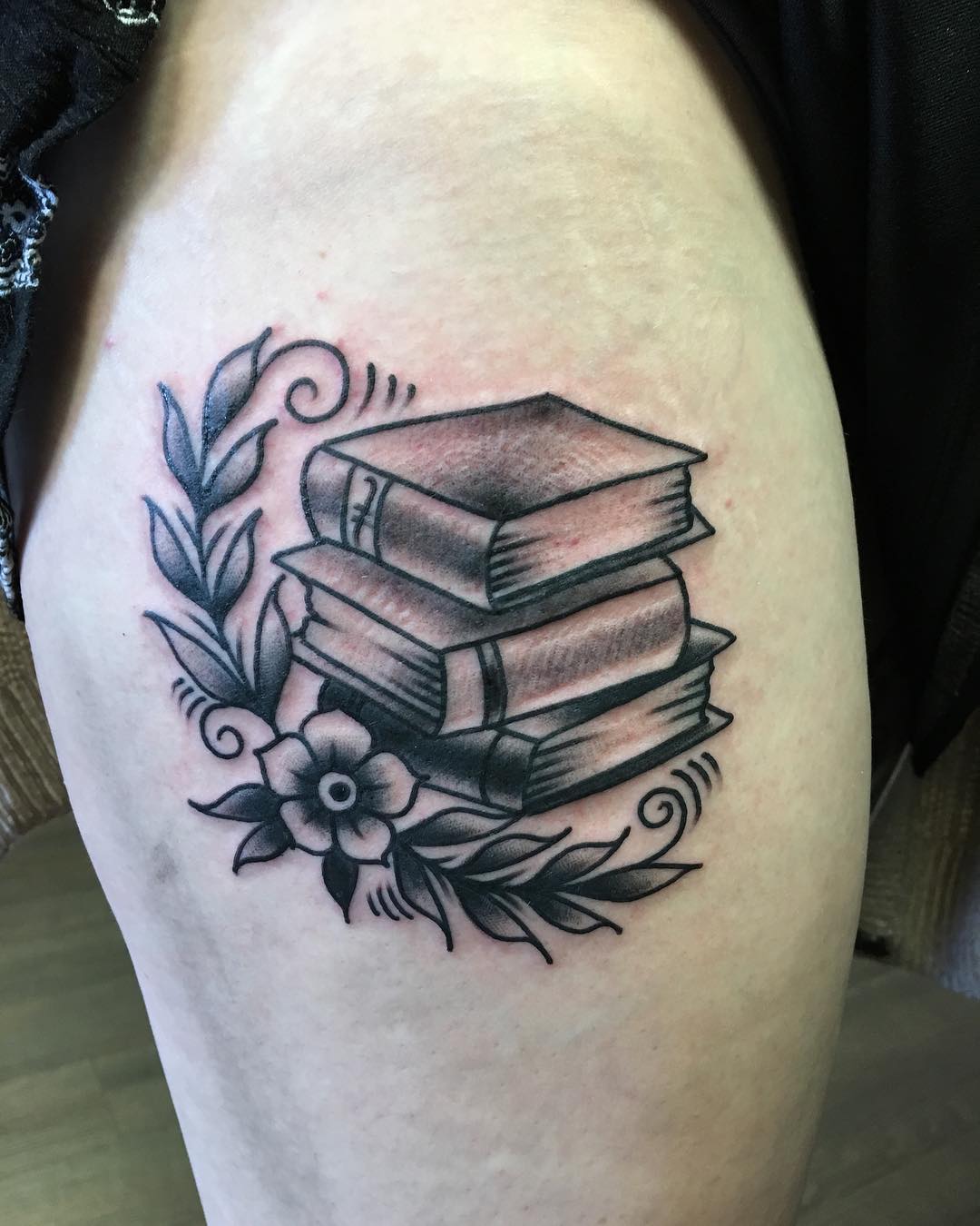 Books With Flower Inked On Thigh