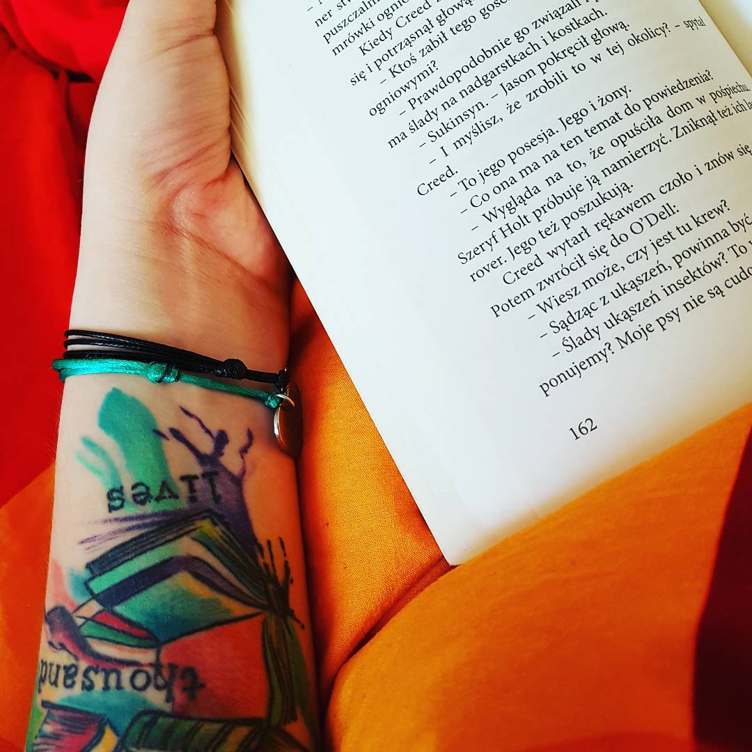 Colored Book Tattoo On Wrist