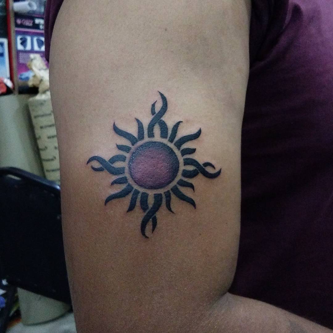 Colored Sun Tattoo On Arm