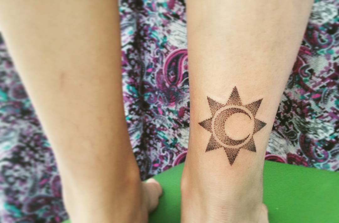 Dotted sun Moon Tattoo On Lower Leg