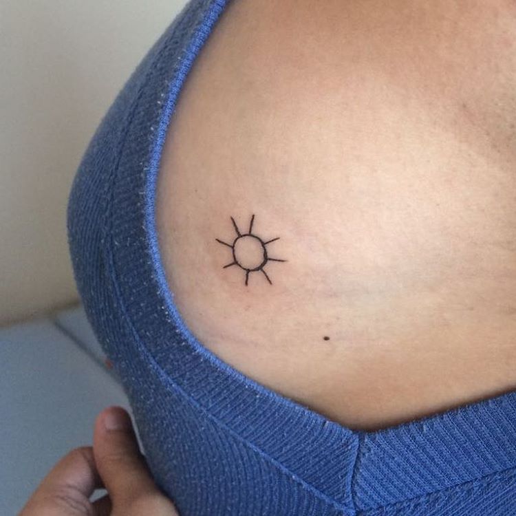 Elegant Sun Tattoo On Chest