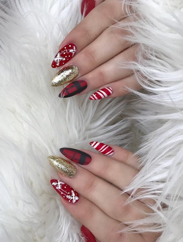 Gorgeous candy cane, plaid, stripes and snowflakes on red nails. Pic by madisonvalgarisalon