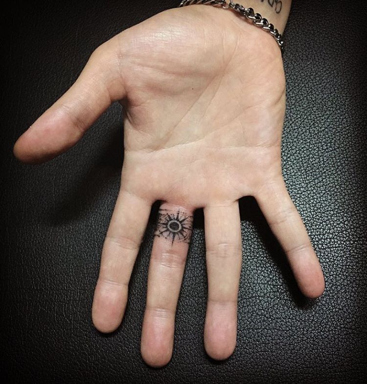 Small Black Tattoo On Finger