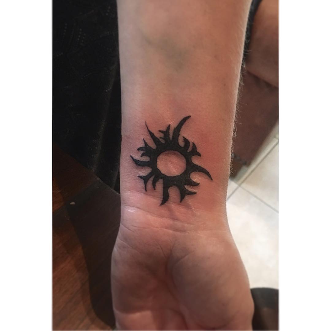 Tribal Sun Tattoo On Wrist