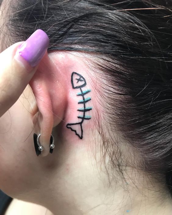 A Little Fish Bone Behind The Ear Tattoo