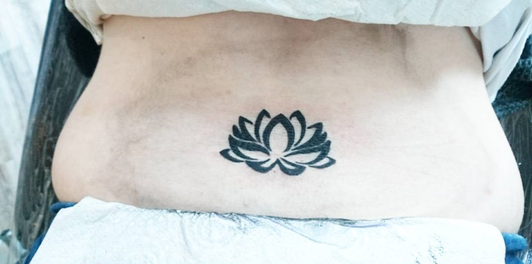 Beautiful Lotus Lower Back Tattoo