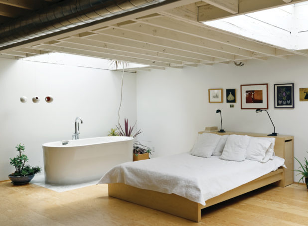 Bedroom Design With Cermic Bath Tub And Wooden Flooring