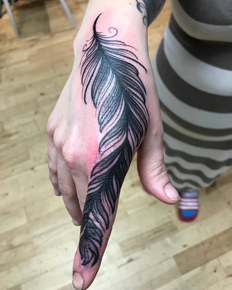 Big Feather On Finger