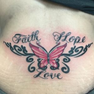 Butterfly With Words Lower Back Tattoo