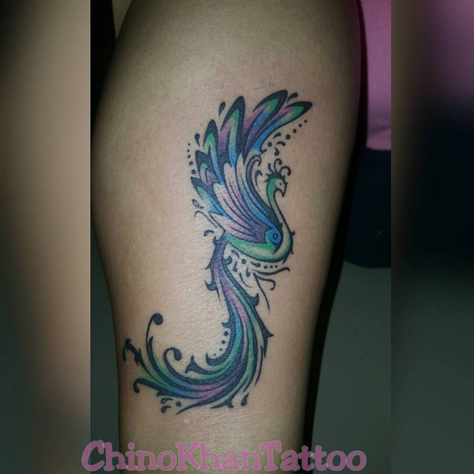 Colored Little Peacock On Lower Leg