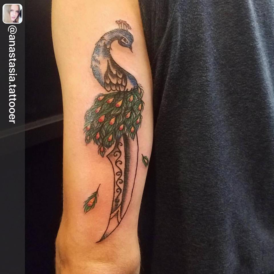 Colored Peacock On Arm