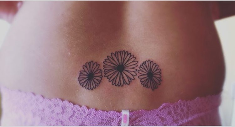 Daisies Inked On Lower Back