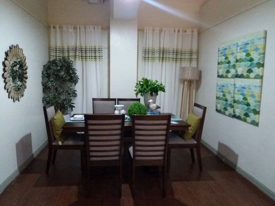Dining Room With Elegant Curtains And Wall Decorations