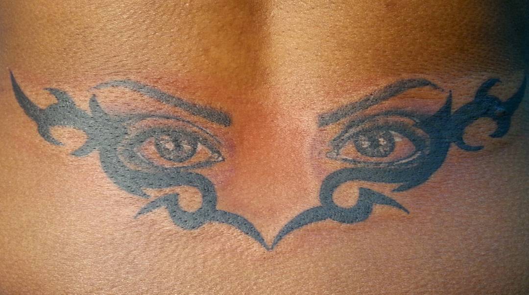 Eyes Lower Back Tattoo