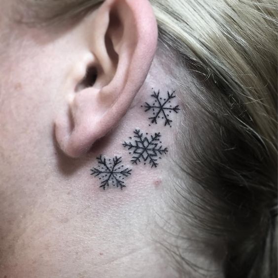 Glamorous Snow Flakes Behind The Ear Tattoo