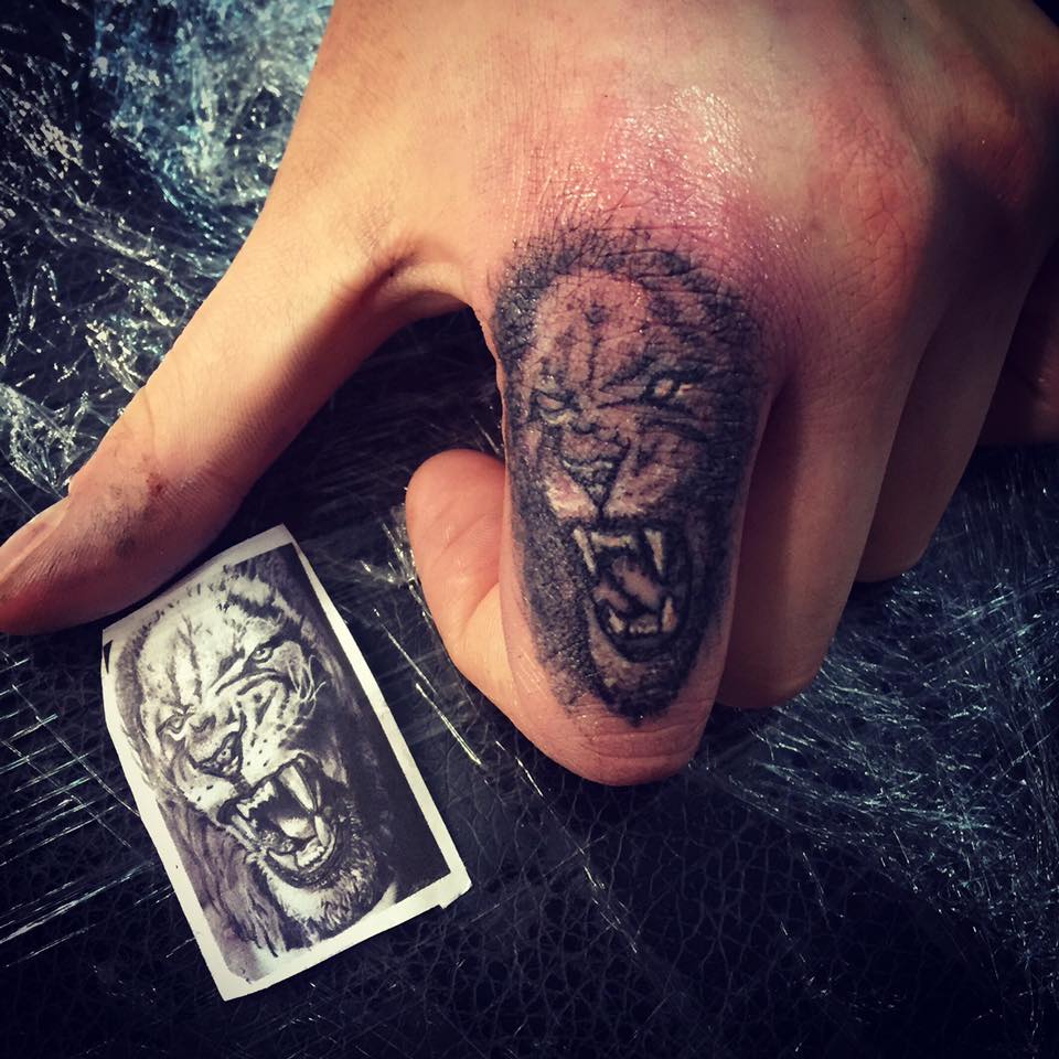 Lion Index Finger Tattoo