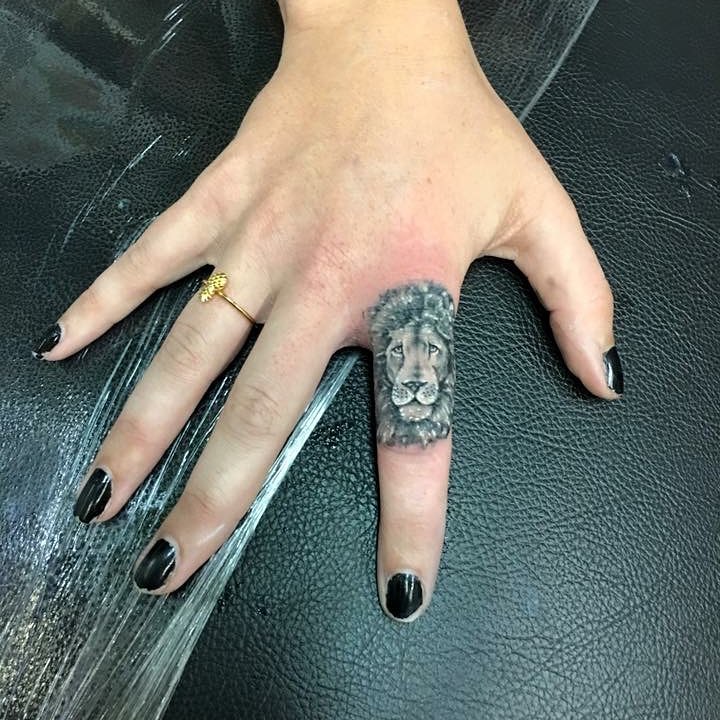 Little Lion Finger Tattoo