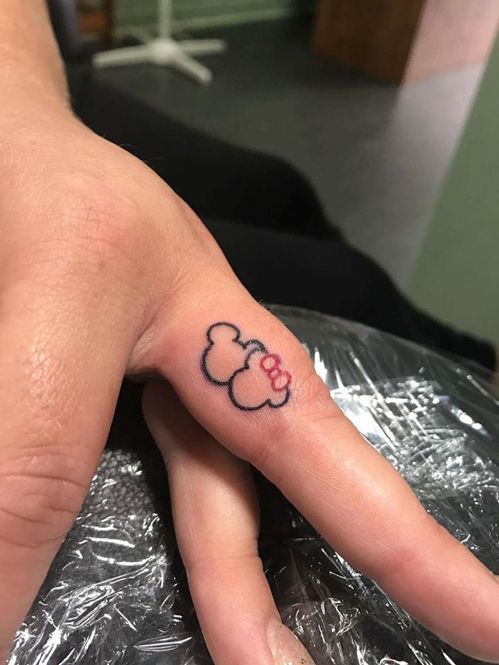 Little Micky And Minnie Ring Finger Tattoo