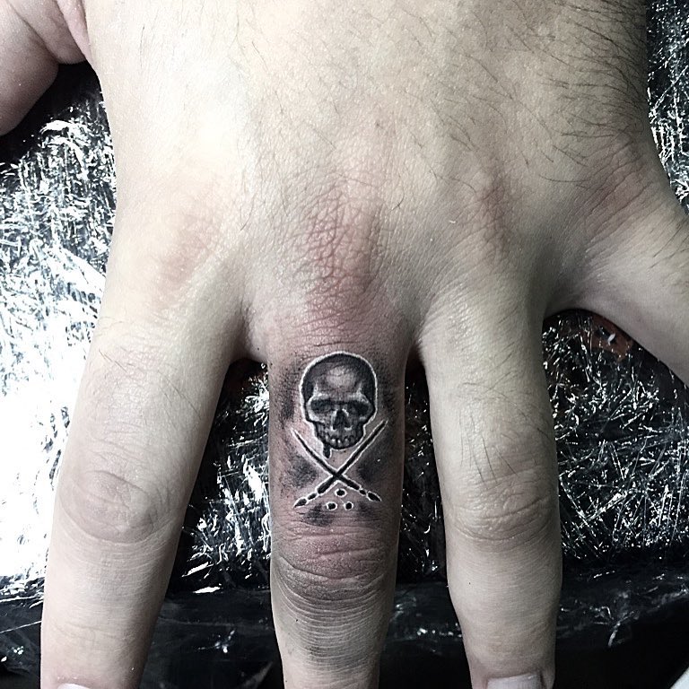 Little Skelton Finger Tattoo