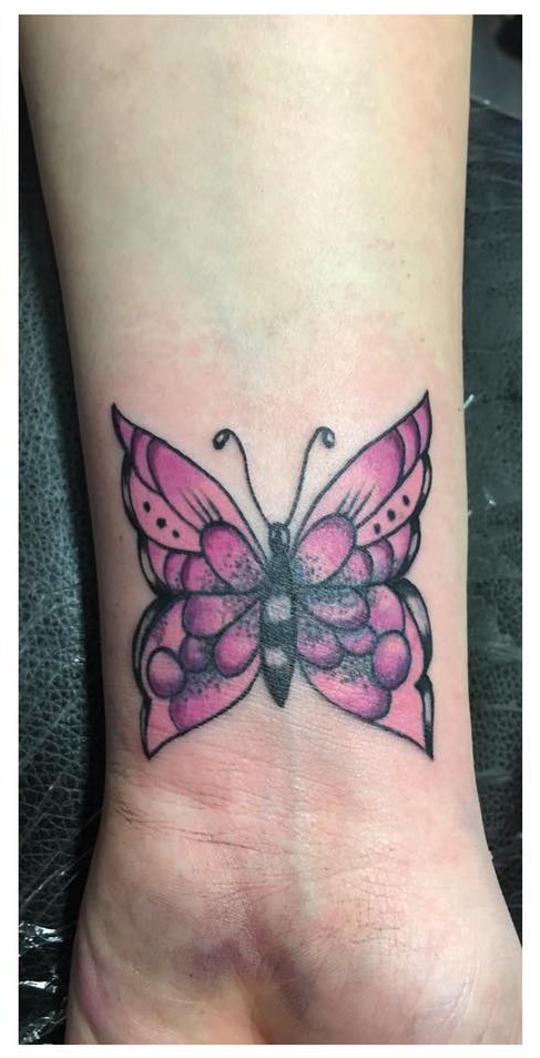 Pink Cover Up Butterfly Wrist Tattoo