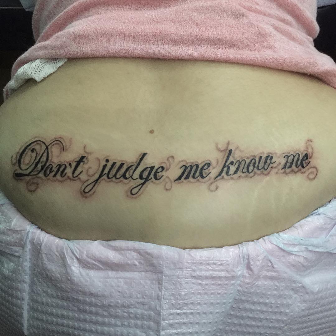 Quote Inked On Lower Back