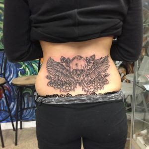 Skull With Roses Lower Back Tattoo