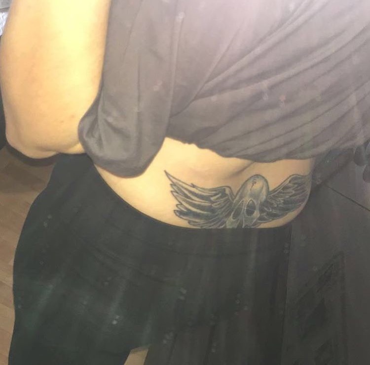 Skull With Wings Lower Back Tattoo
