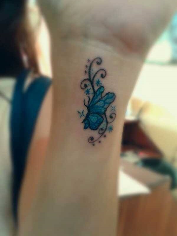 Tiny Aqua Blue Butterfly Tattoo On Wrist