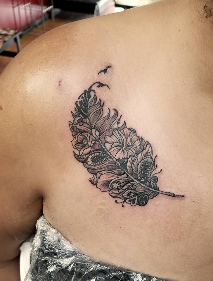 Unique Feather With Flowers Tattoo Idea