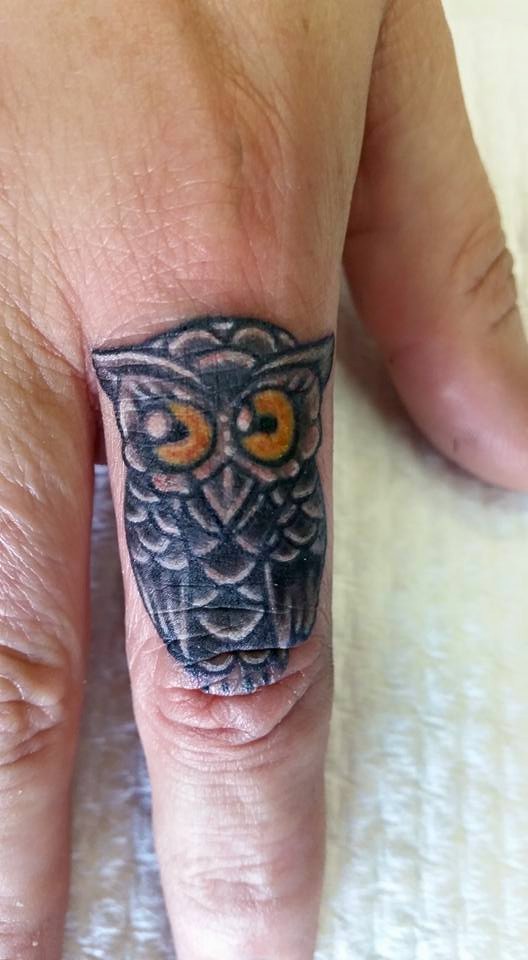 Amazing Tiny Owl On First Finger