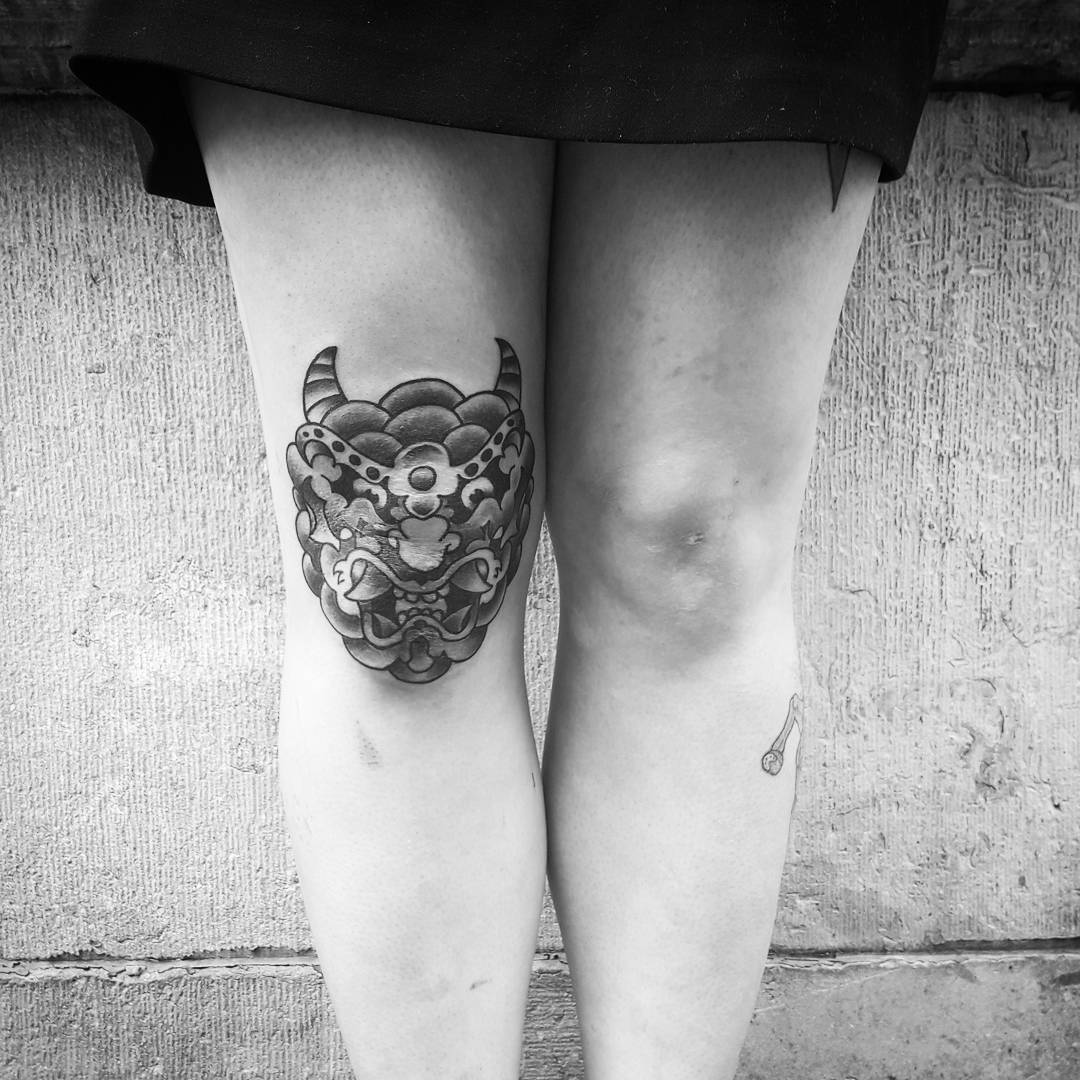 Appealing Mask Knee Tattoo Idea