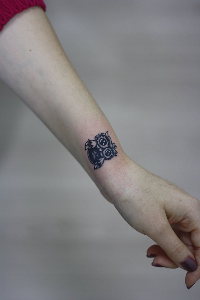 Black Tiny Owl Tattoo On Wrist