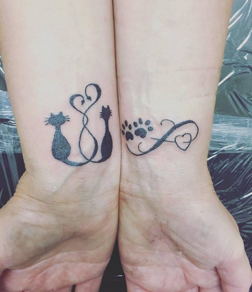 Gorgeous Two Sweet Little Cat Tattoos On Wrist