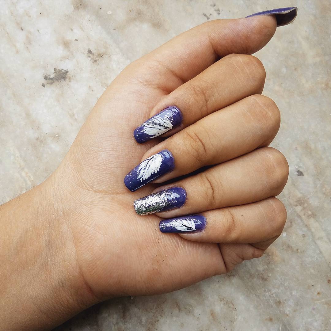 Graceful Purple And White Feather Nail Art