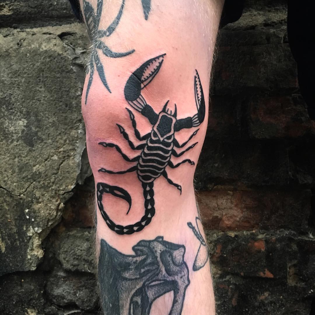 Traditional Black Scorpio Tattoo On Knee