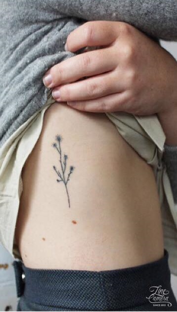Attractive Minimalist Tattoo On Ribs