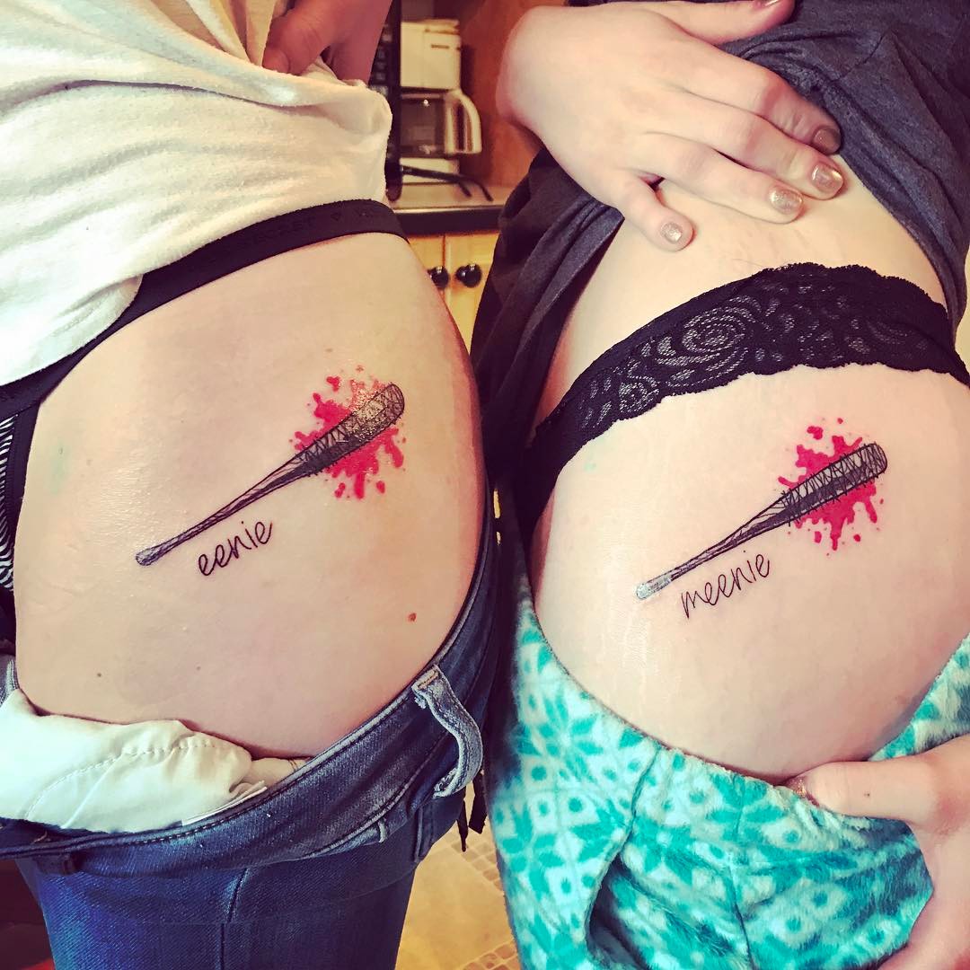 Fascinating Sibling Tattoo On Lower Back