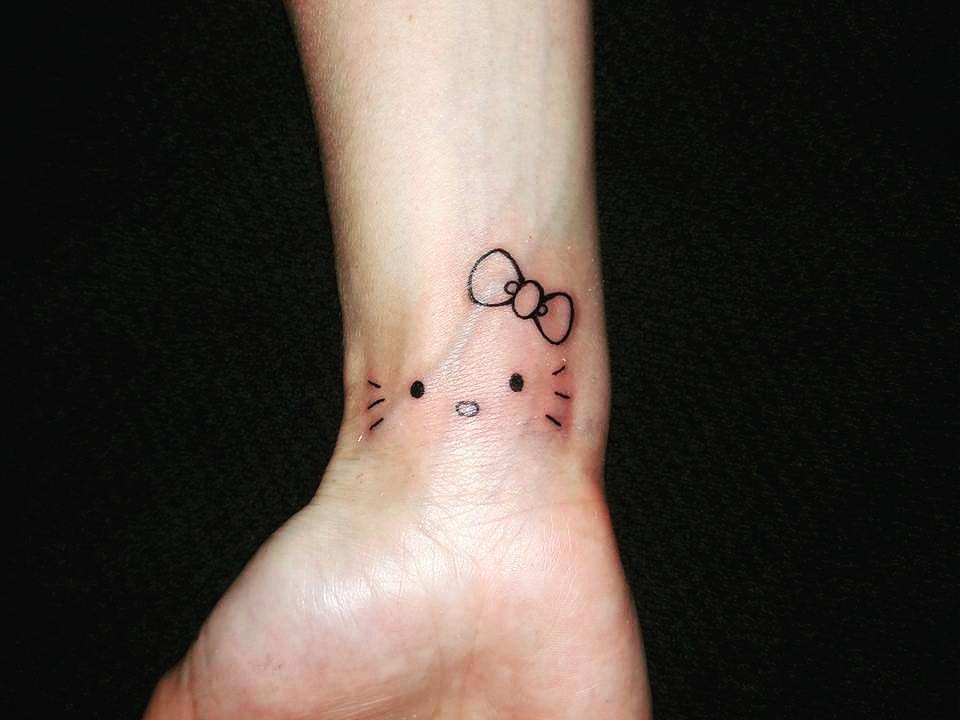 Incredible Kitty Minimalist Tattoo On Wrist