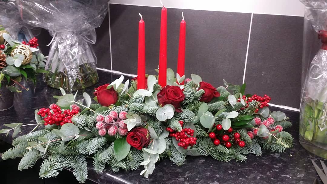 Fabulous red roses , red berries and red candles on the table. Pic by isisflowersbeautifulpictures