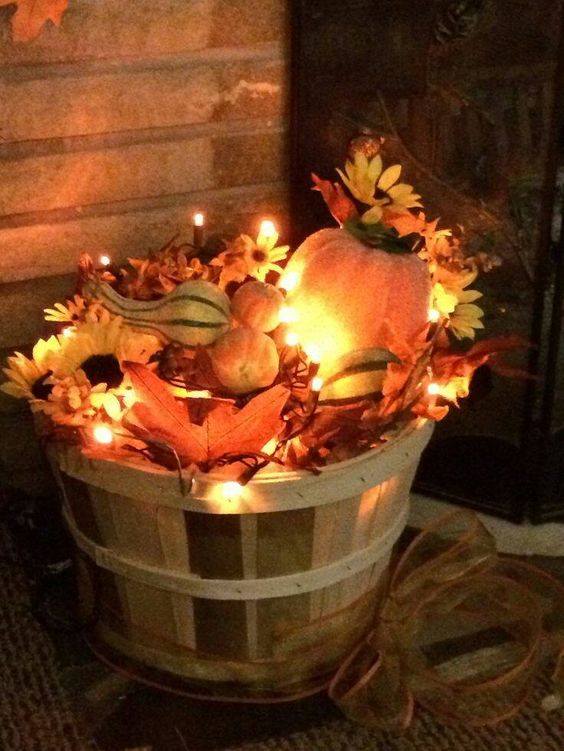 Basket Is Filled With Lights, Leaves and Fruits Looks Fabulous