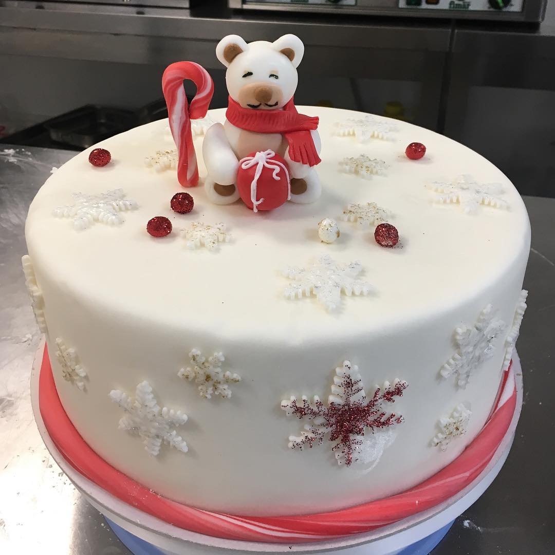 Cute Christmas cake with snowflakes and bear. Pic by glace.glace