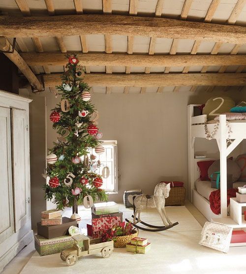 Kids Room Is Decorated With Tree And Gifts